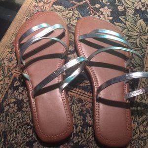 Strappy and silver flat sandals